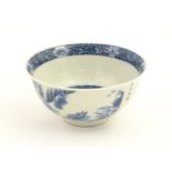 A Chinese blue and white bowl with Character script decoration and a river landscape scene to