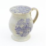 A Victorian stoneware jar with single handle and screw lid. With transfer printed decoration