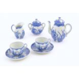 A quantity of Oriental blue and white tea wares decorated with iris flowers and foliage, to