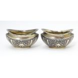 A pair of silver salts with embossed decoration. hallmarked Birmingham 1904 maker Joseph Gloster