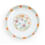 A Chinese famille rose plate / dish decorated with floral and foliate decoration, the reverse with a