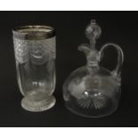 A 19thC whisky water jug and stopper. Together with a 19thC cut glass vase with silver rim,