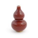 A Chinese sang de boeuf double gourd vase. Approx. 6 1/4" high Please Note - we do not make