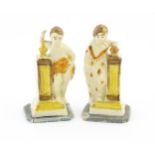 A pair of English creamware pottery Classical figures with column detail. Approx. 4 3/4" high (2)