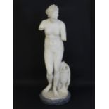 A composite marble sculpture depicting Aphrodite / Venus with a large urn. Approx. 30" high