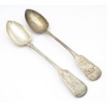 A pair of Geo III silver fiddle pattern basting / serving spoons. Hallmarked London 1819 maker J.W