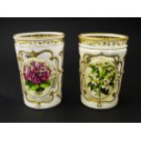 Two 19thC Bohemian glass beakers with white overlay, gilt highlights and hand painted floral sprays.