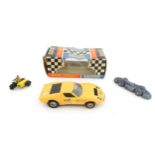 Toys: Three assorted scale model vehicles to include a boxed Scalextric C9 Ferrari GP race car in