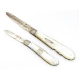 Two silver folding fruit knives with mother of pearl handles hallmarked Birmingham 1883 maker