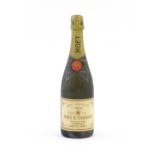 A 1975 75cl bottle of Moet & Chandon dry imperial champagne. Please Note - we do not make