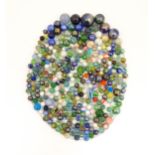 Toys: A quantity of marbles, many with colours twists. Largest approx. 1 3/4" diameter Please Note -
