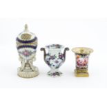 Two Continental porcelain items comprising a Serves style pot pourri holder of egg form with