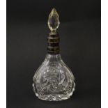 A cut glass scent / perfume bottle and stopper, the silver collar with banded detail and