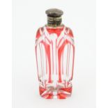 A Bohemian glass scent / perfume bottle with red detail and a Continental silver gilt lid. Approx. 3