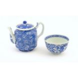 A Chinese blue and white teapot decorated with prunus blossom. Together with a Chinese blue and