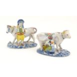 Two French Quimper style faience figural models comprising cow and milk maid, and man with cow.