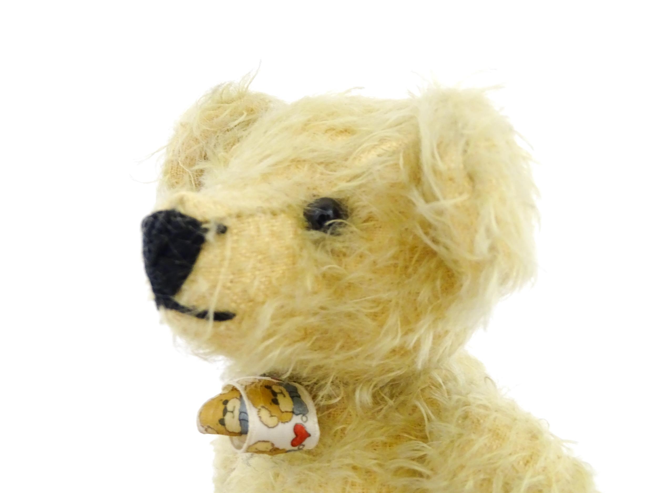 Toy: A 20thC mohair teddy bear with stitched nose and mouth, pad paws, and articulated head and - Image 7 of 7