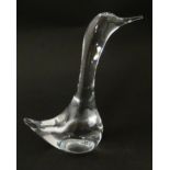 A clear glass model of a goose, signed Daum France. Approx 7 1/2" high Please Note - we do not