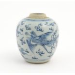 A small Chinese blue and white jar decorated with phoenix birds amongst stylised clouds. Approx. 4
