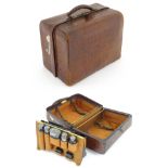 A lather vanity / valise travelling case having fitted section within with various Victorian