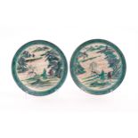 Two Japanese Ko Kutani plates decorated with a mountainous river landscape scene with two