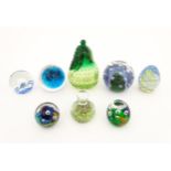 Eight assorted glass paperweights, one signed Mdina 1011/98. The largest approx. 6 1/2" high (8)