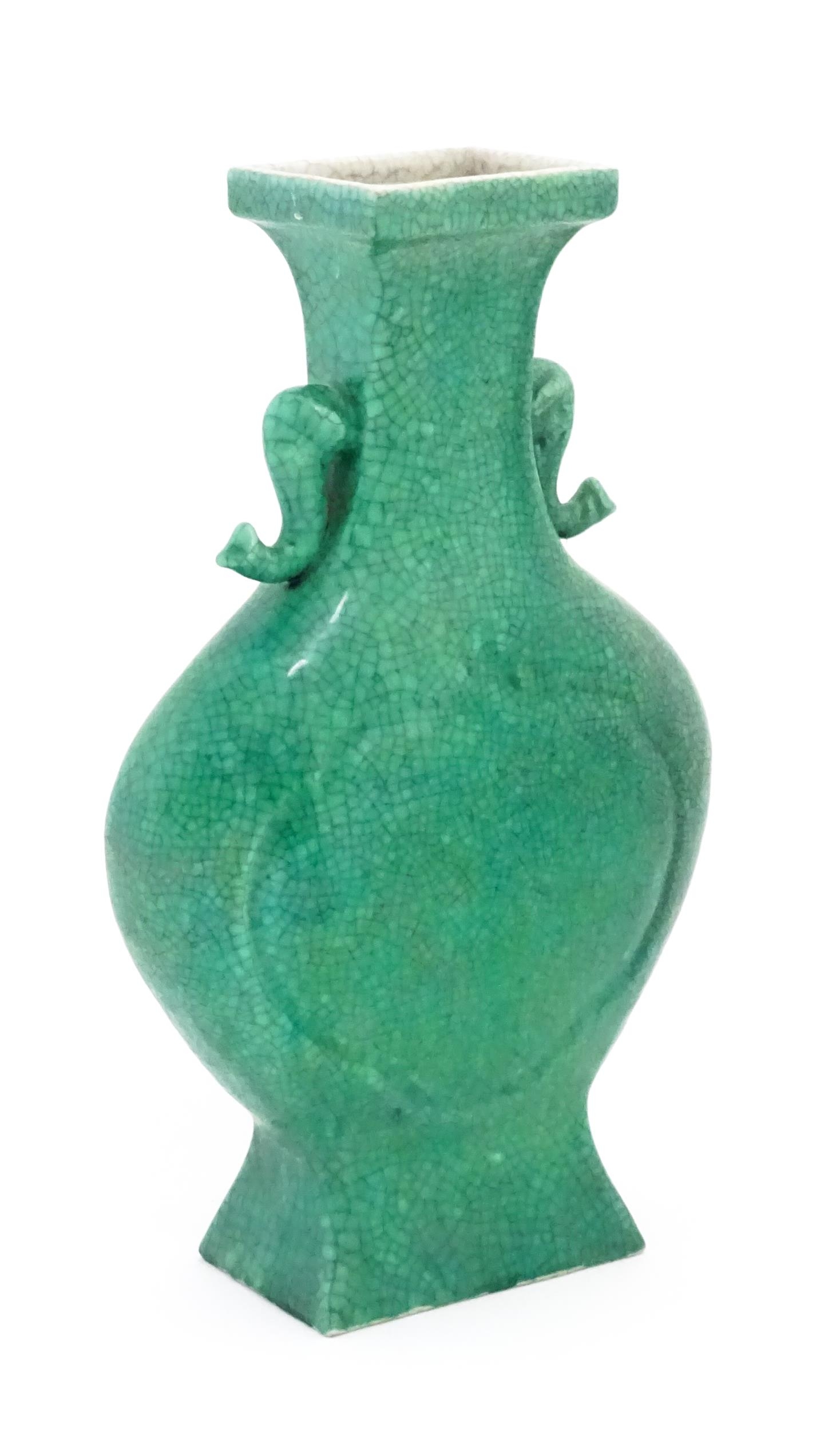 A Chinese vase of shaped form with twin elephant head handles with a green crackle glaze. Approx. - Image 4 of 6