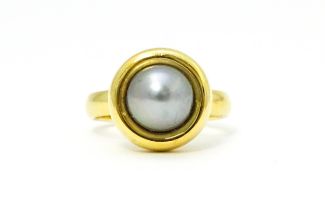 A 18ct gold ring set with Blue Akoya Oyster pearl. Ring size approx. M 1/2 Please Note - we do not