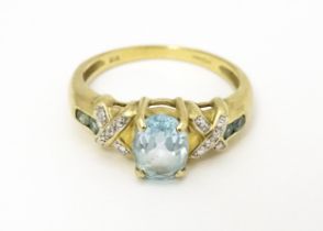 A 9ct gold ring set with aquamarine and diamond. Ring size approx. O Please Note - we do not make