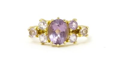 A 14ct gold ring set with amethyst. Ring size approx. N. Please Note - we do not make reference to