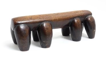 Ethnographic / Native / Tribal: A tribal carved wooden head rest with eight supports. Approx. 4 1/4"