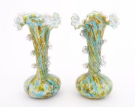 A pair of art glass vases with flared rims and prunt detail. Approx 9 1/2" high Please Note - we