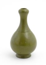 A Chinese bottle vase with tea coloured glaze. Character marks under. Approx. 11" high Please Note -