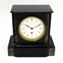 A 19thC French mantel clock , the white enamel dial with roman numerals and signed Wilson &