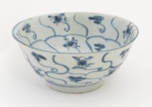 A Chinese blue and white Tek Sing bowl decorated with stylised floral motifs. Bearing Nagel Tek Sing
