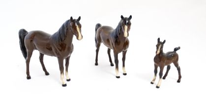 Two Royal Doulton brown horses and a brown foal. Largest approx. 6 1/2" high (3) Please Note - we do