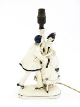 A table lamp with a Continental figure group base modelled as a couple dancing. Approx. 21" high