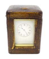 A late 19thC French brass cased repeating carriage clock, the movement striking on a gong, with