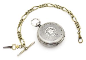 A silver pocket watch with white enamel dial with Roman numerals and subsidiary seconds dial. The