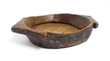 A large 20thC carved fruit wood centrepiece / fruit bowl with pointed twin handles. Approx. 3 1/2"