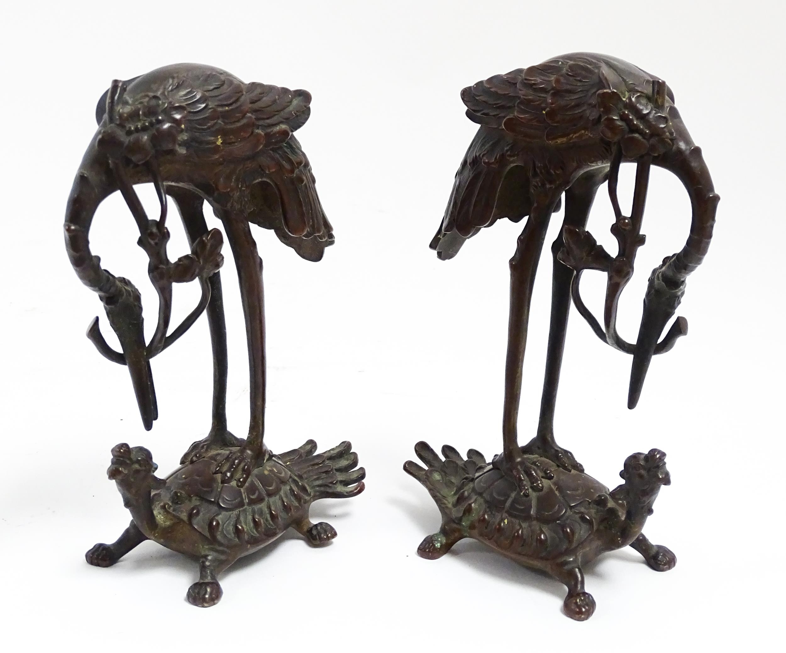 A pair of Japanese cast sculptures modelled as a stylised crane standing on a tortoise. Approx. 7 - Image 4 of 6