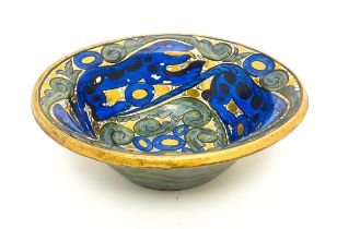 A John Pearson studio pottery lustre bowl with repeated stylised salamander detail. Signed under