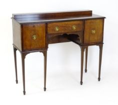 A 19thC mahogany sideboard, having a raised upstand above a moulded top edge and small central