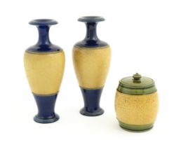 A pair of Royal Doulton Slaters patent stoneware vases with blue glaze and relief banded detail.