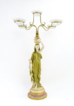 A Royal Worcester five branch Cricklite candle holder modelled as a Grecian Water Carrier. With five