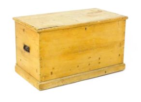 A 19thC pine trunk / blanket box, with wrought iron carrying handles to each side, the lid lifting