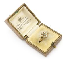 A Victorian gold ring set with emeralds and pearls. Ring size approx. O Please Note - we do not make