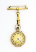 A fob / corsage watch with 9ct gold case with import marks for London 1912 importer Stockwell &
