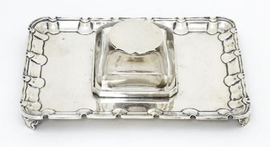 A silver standish with central inkwell, the base hallmarked Sheffield 1892, maker Harrison