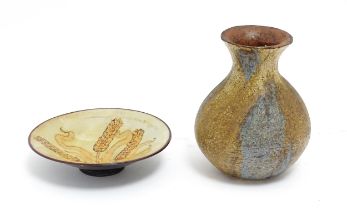 Two items of studio pottery comprising a Chelsea Pottery plate with wheat detail by Hazel Levy,